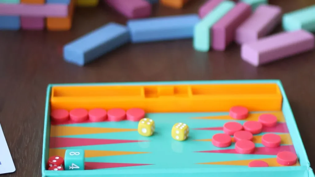 Board games and coloured wooden blocks on a table, a family evening in holiday accommodation in Gloucester