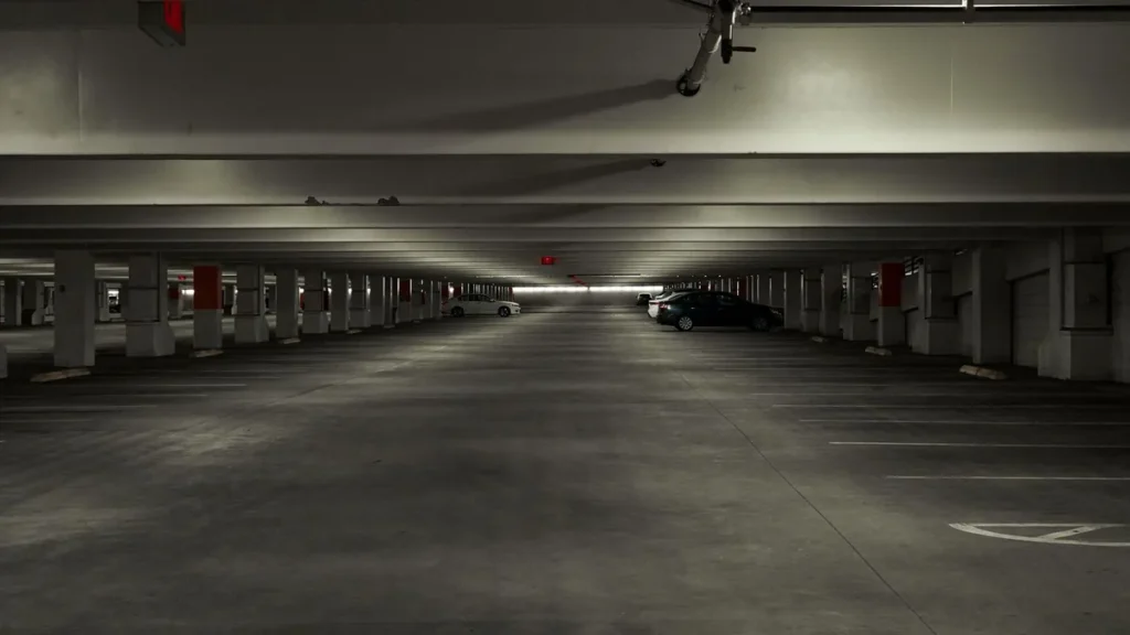 An almost empty multi-storey car park with low concrete ceilings, the problem accommodation in Gloucester with parking avoids